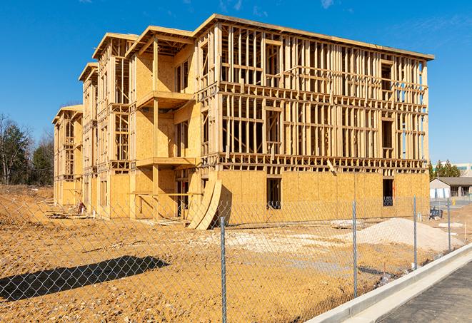 a snapshot of temporary chain link fences protecting a large construction project from unauthorized access in Roeland Park